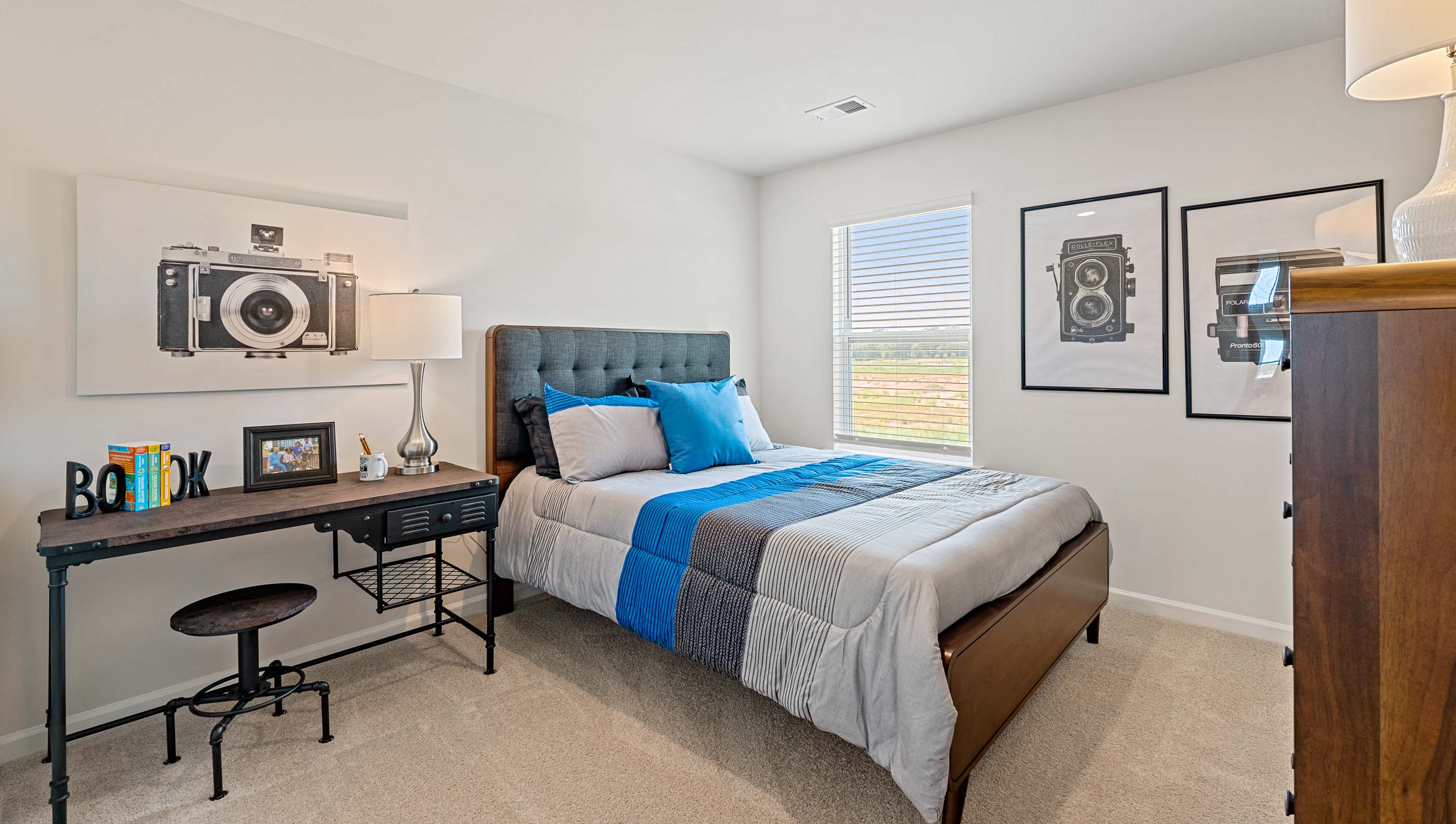 Bedroom with carpet and window.