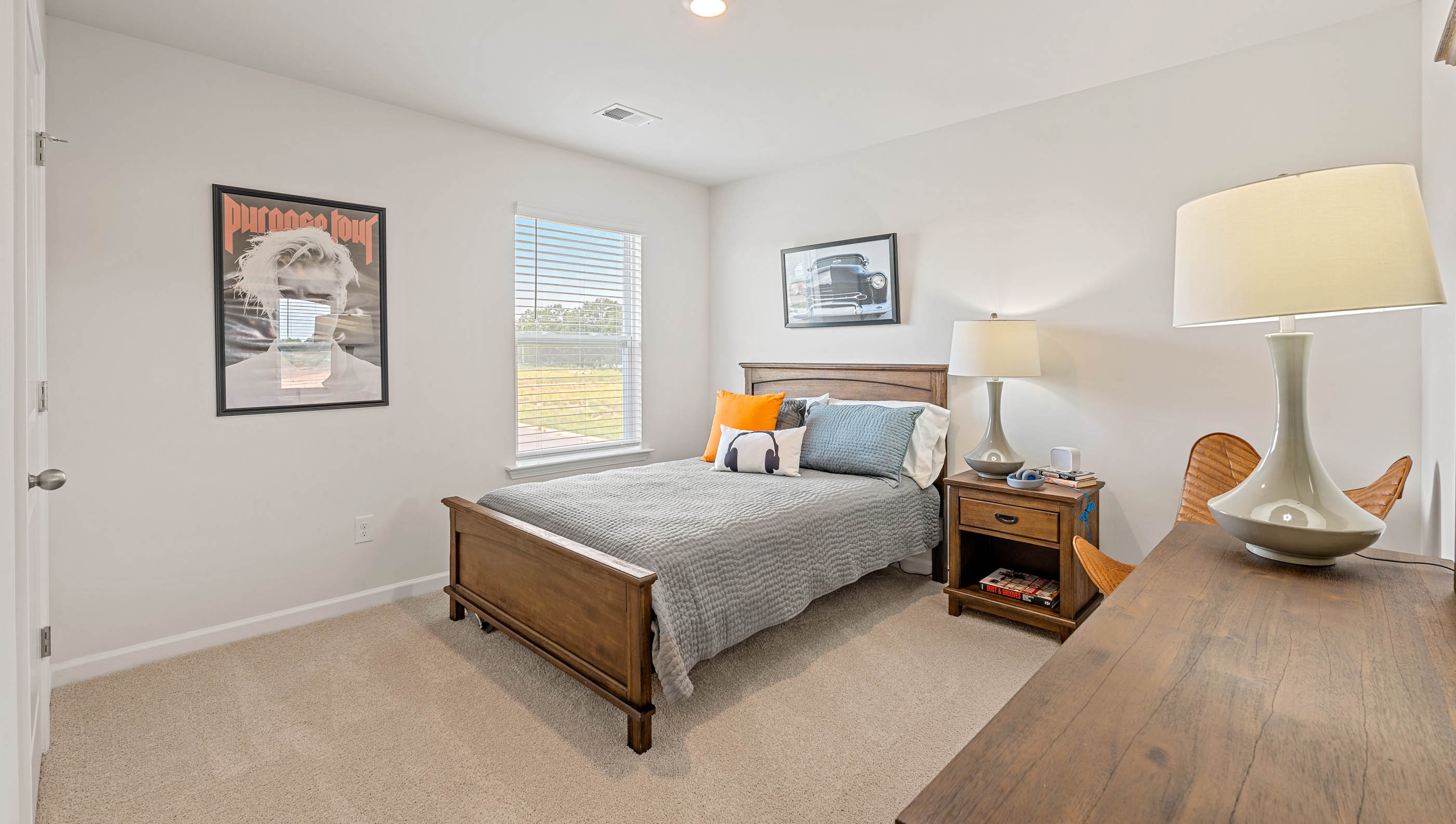 Bedroom with carpet and window.