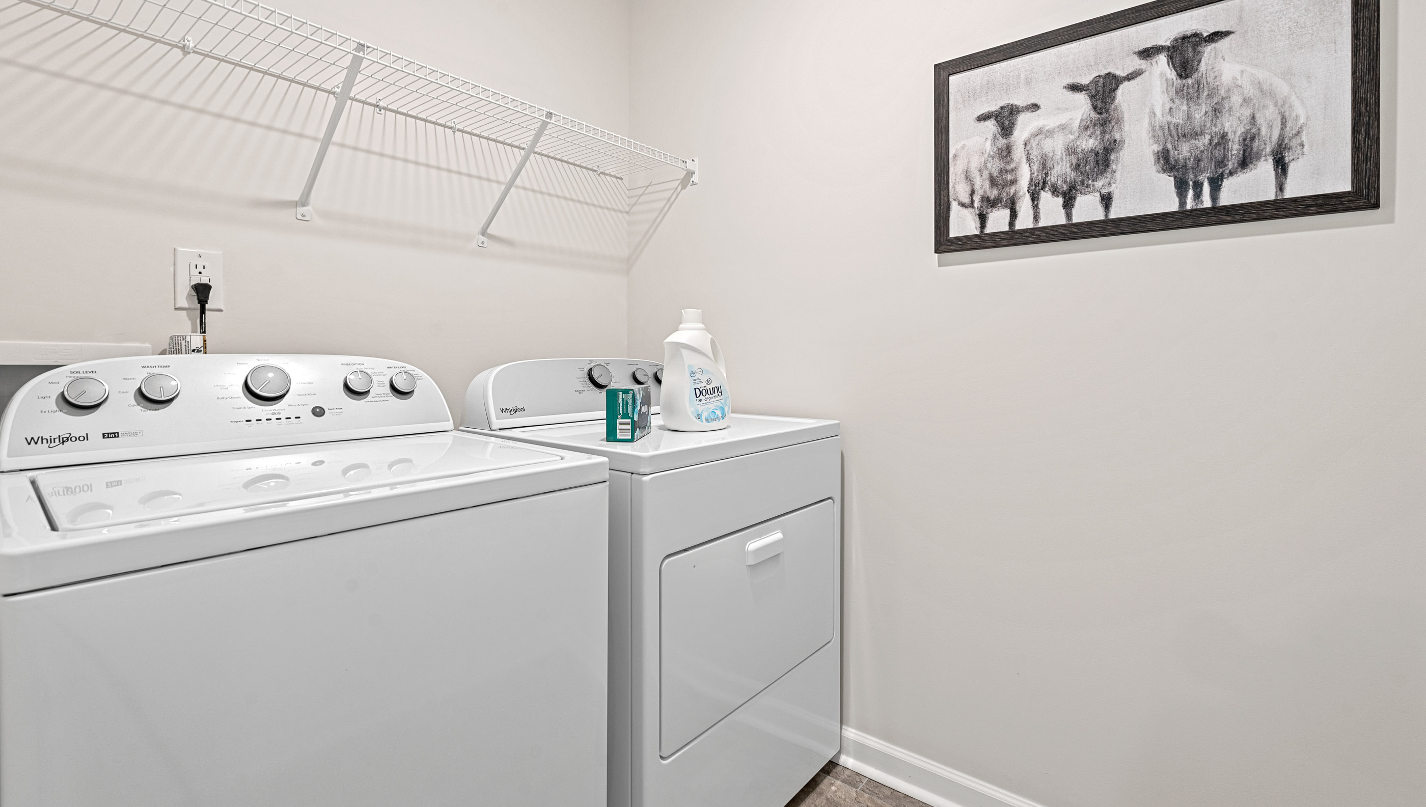 Laundry room with hanging storage racks.