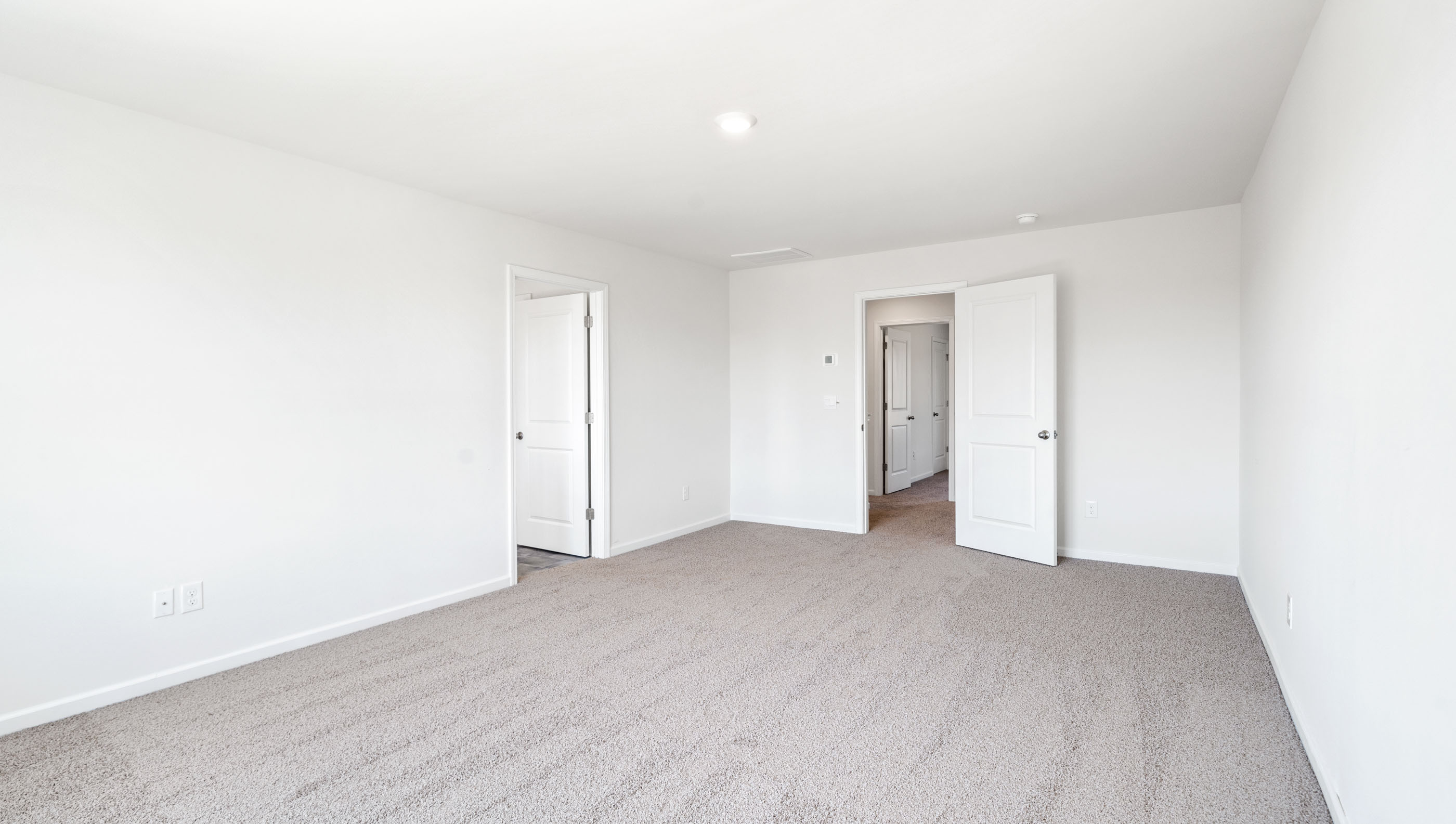 Bedroom with carpet.