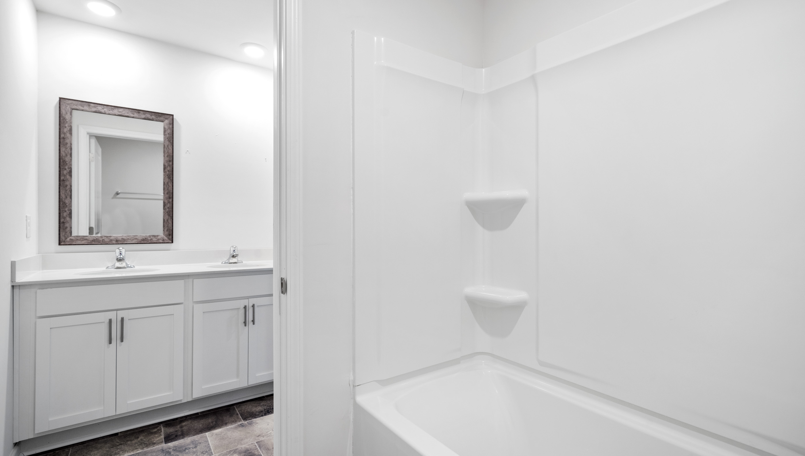 Bathroom with vanity and tub.