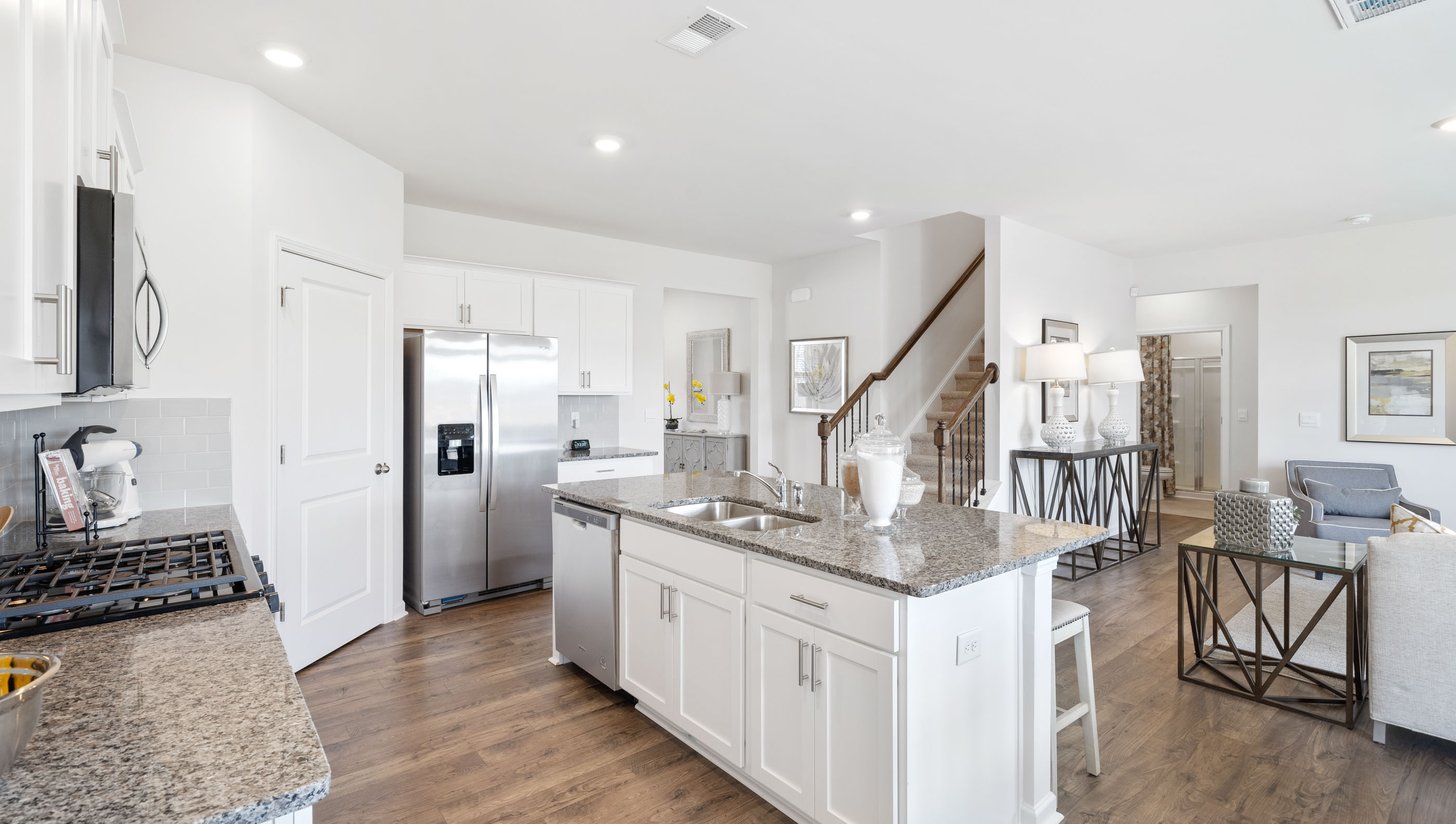 Kitchen and island with granite counter tops.