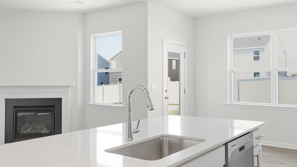 Kitchen with quartz countertops.