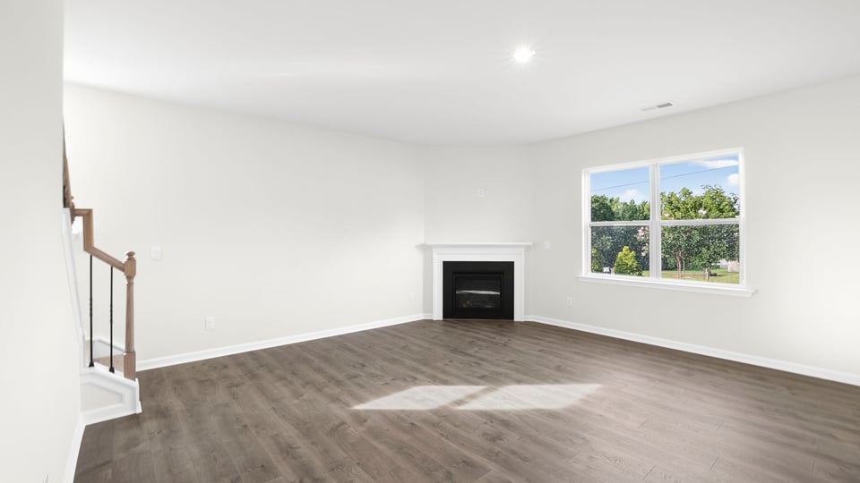 Living area with fireplace and window
