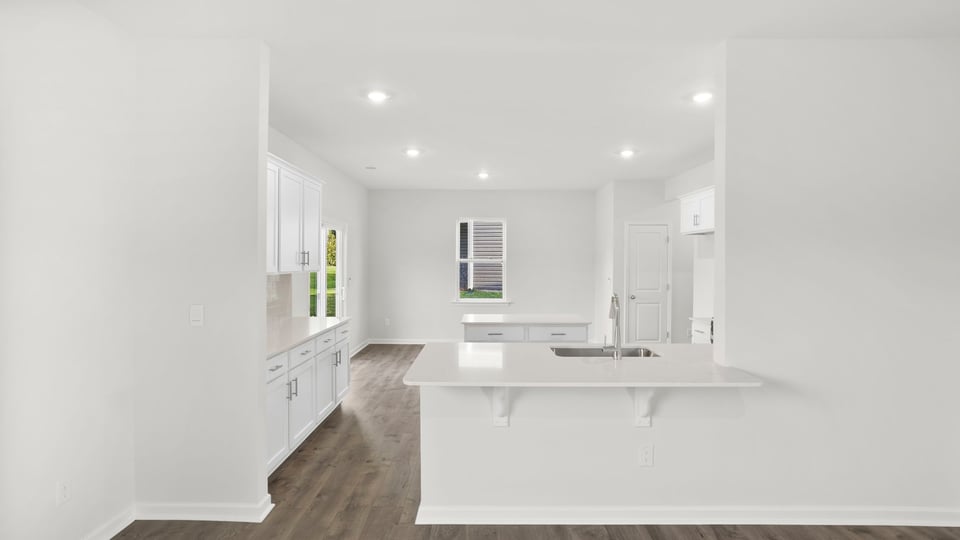 View of kitchen and dining area from living area