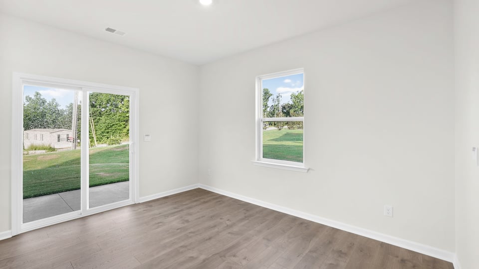 Dining area with window and sliding glass door