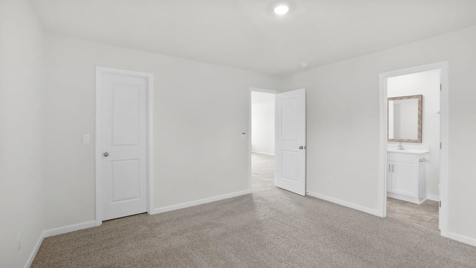 Bedroom with carpet and closet