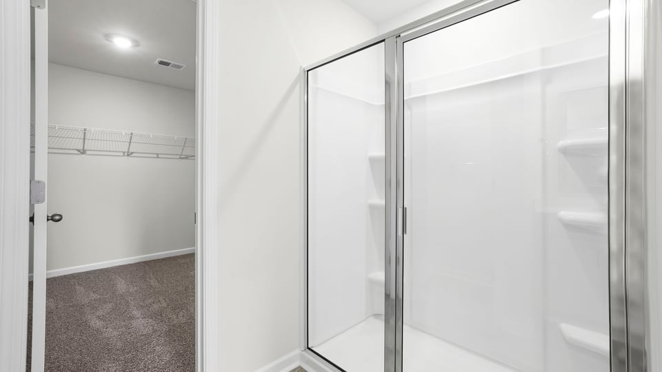 Primary bathroom glass shower and closet