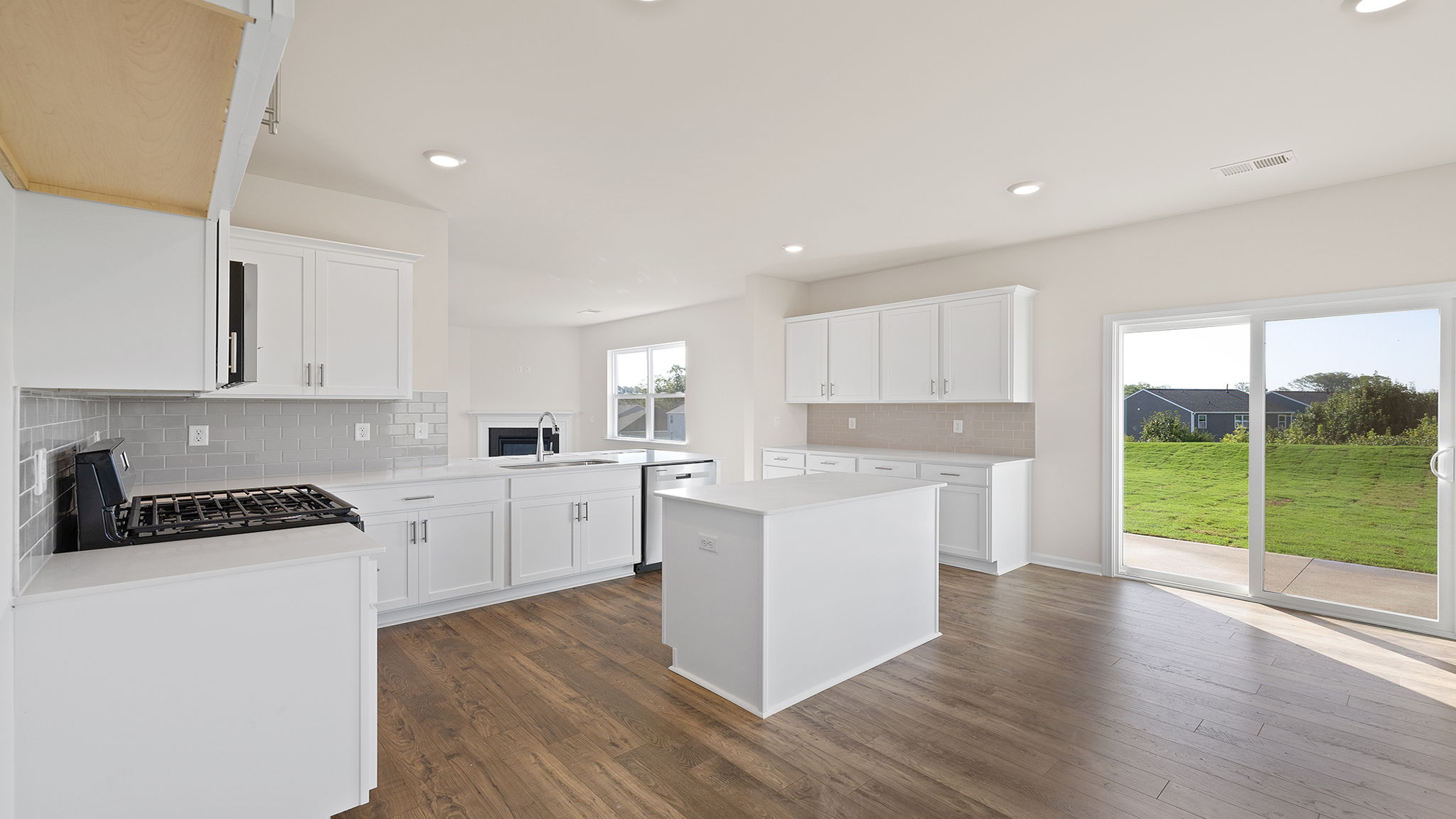 Kitchen and island with granite countertops.