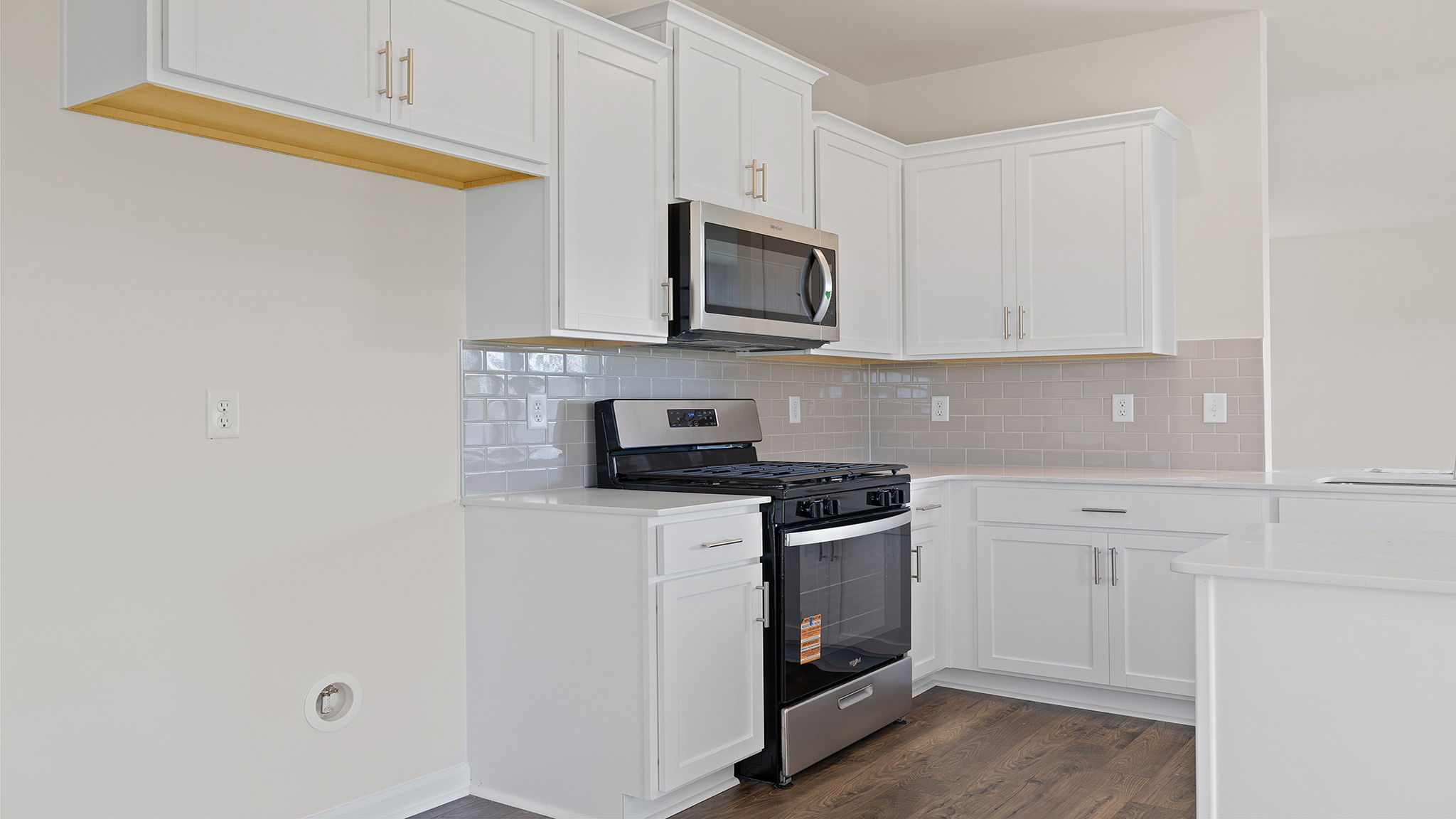 Kitchen with granite countertops and stainless steel appliances.