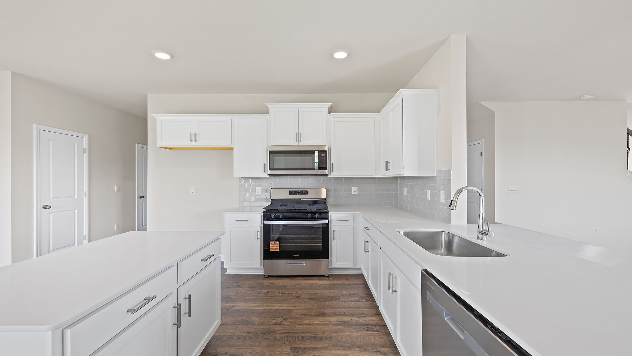 Kitchen and island with granite countertops.