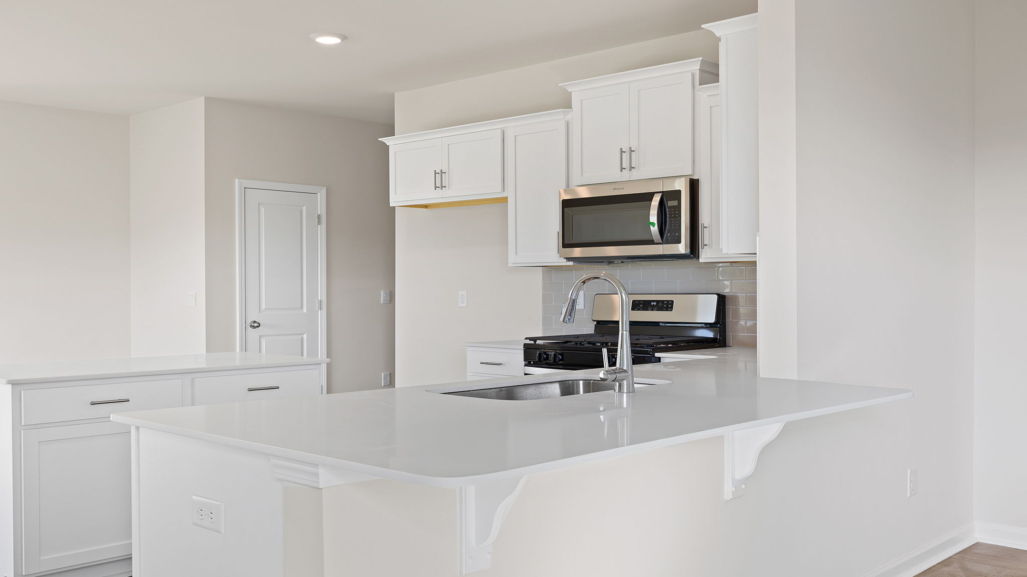 Kitchen and island with granite countertops.
