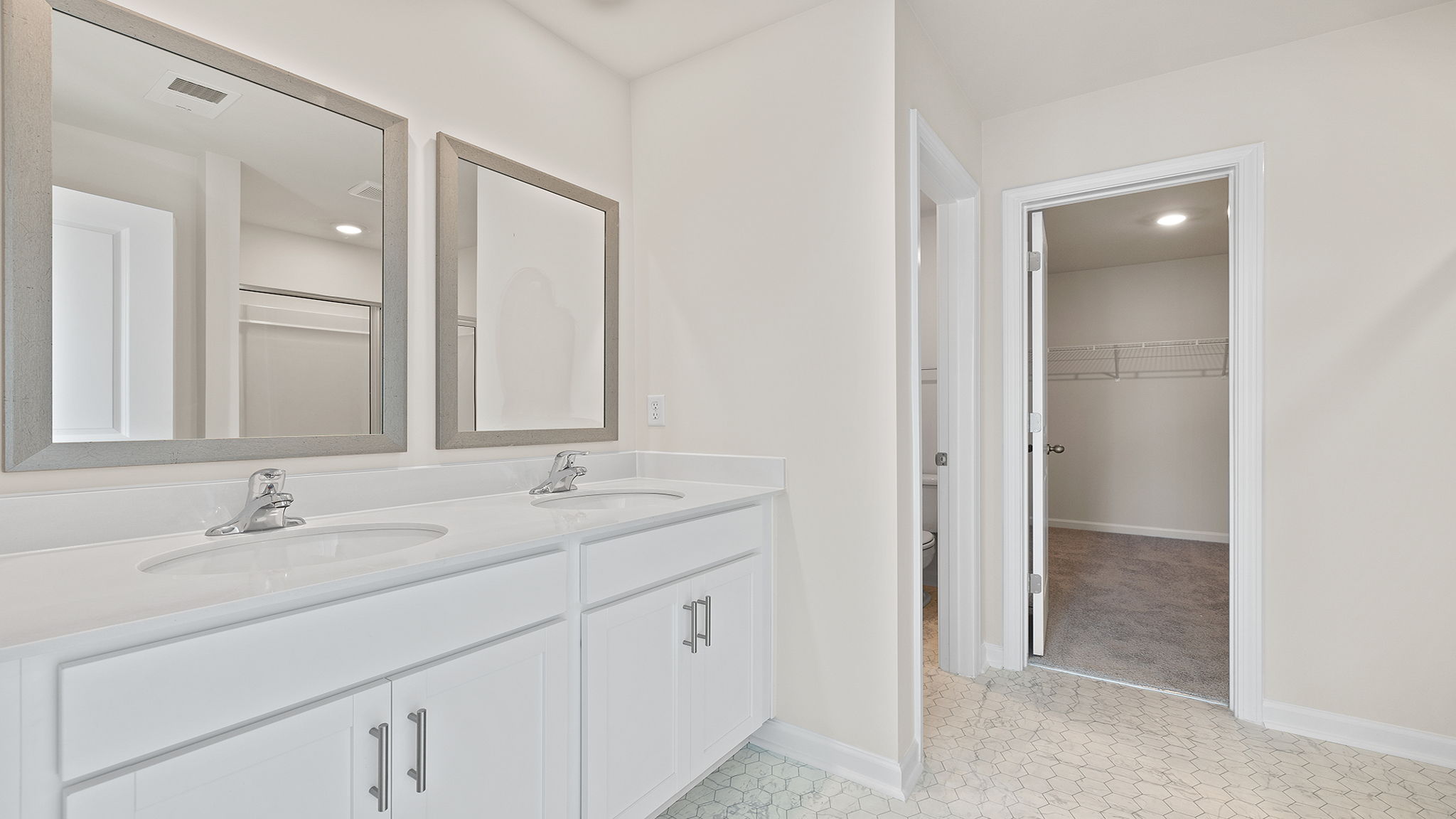 Bathroom with dual vanity.