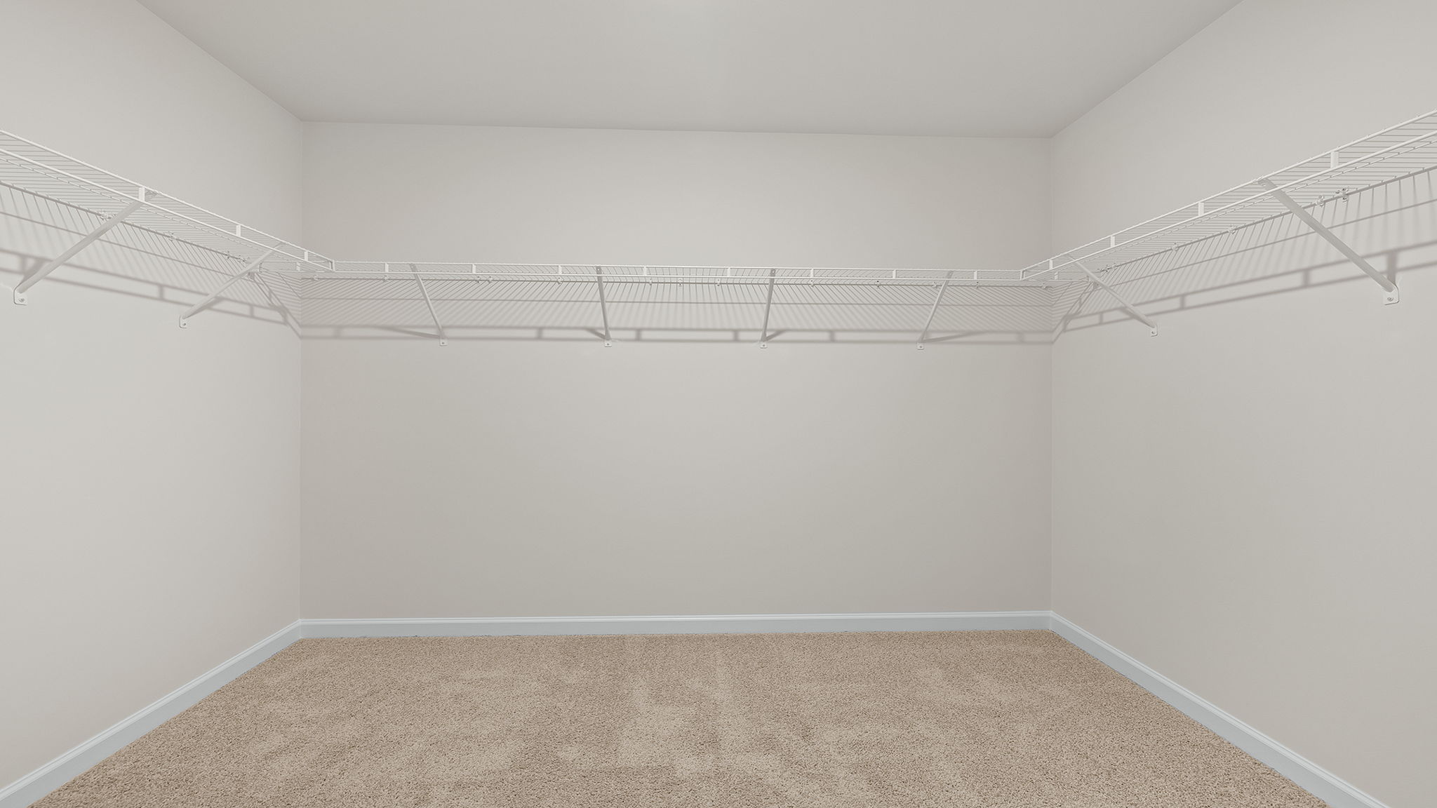 Walk in closet with shelves.