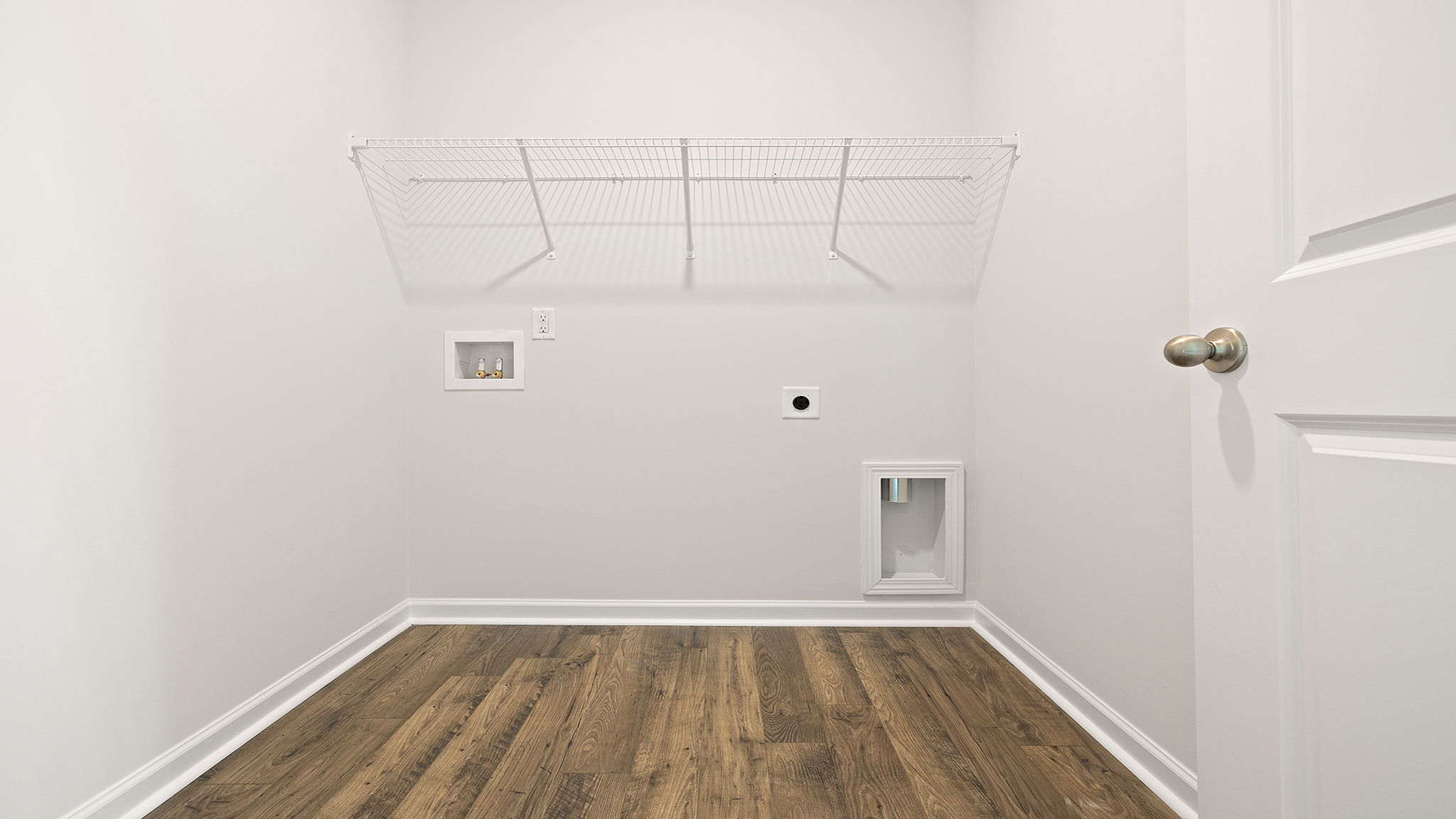 Walk in laundry with shelves.