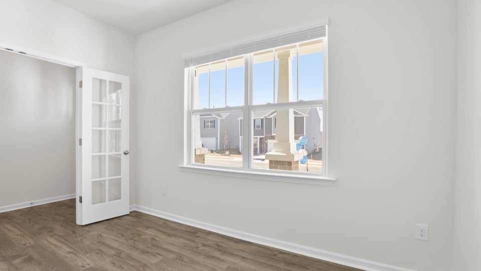 Office with windows and French doors.