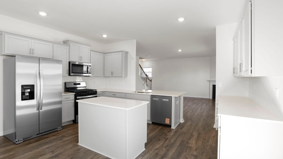 Kitchen and island with granite countertops.