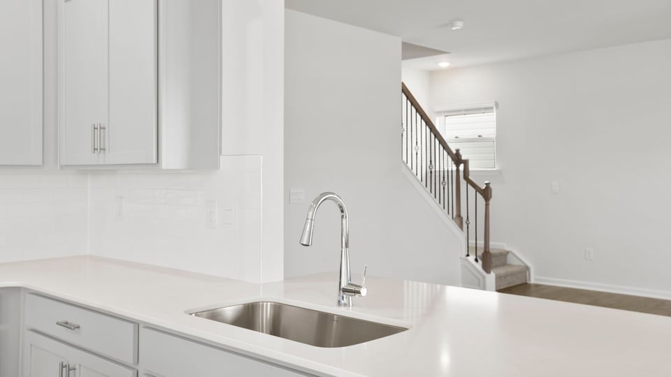 Kitchen and island with granite countertops.