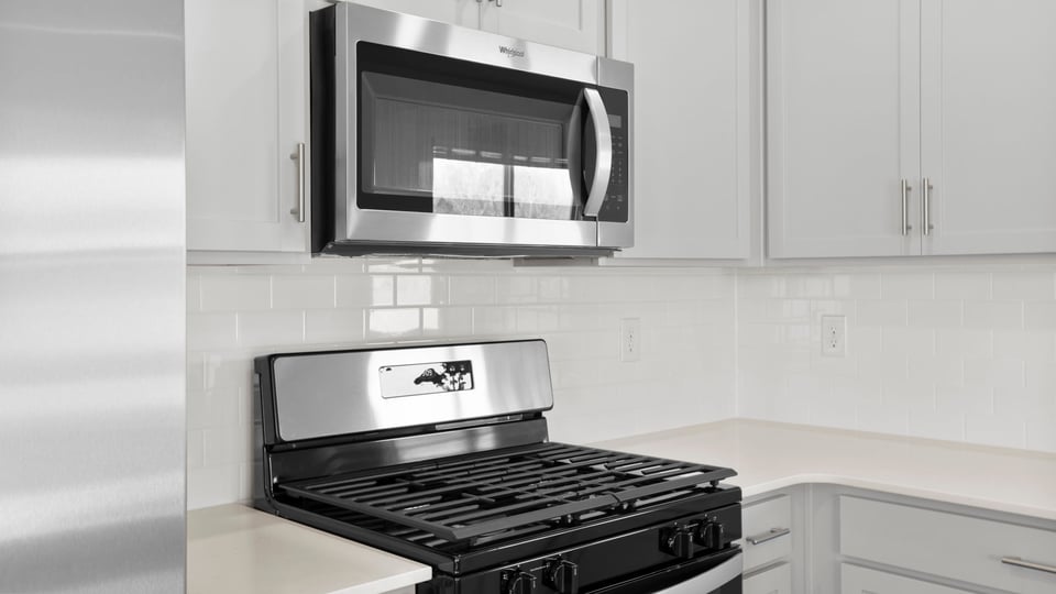 Kitchen with granite countertops and stainless steel appliances.