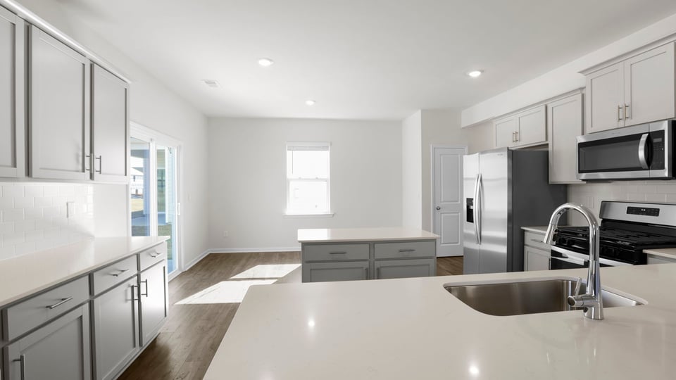Kitchen and island with granite countertops.