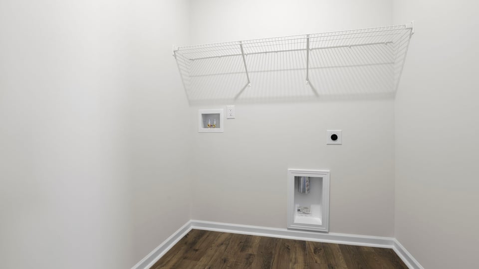 Walk in laundry with shelves.