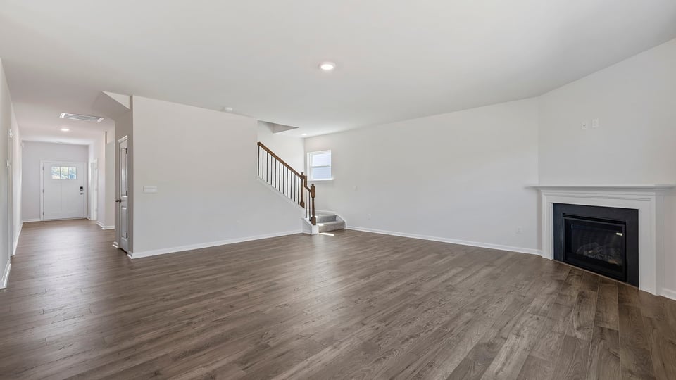 Family room with fireplace and windows.