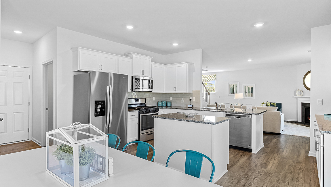 Kitchen and island with granite counter tops.