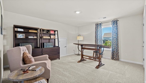 Loft area with carpet.