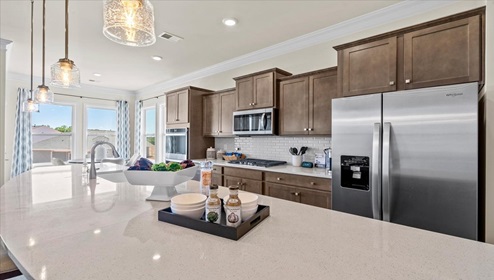 Kitchen and island with granite counter tops.