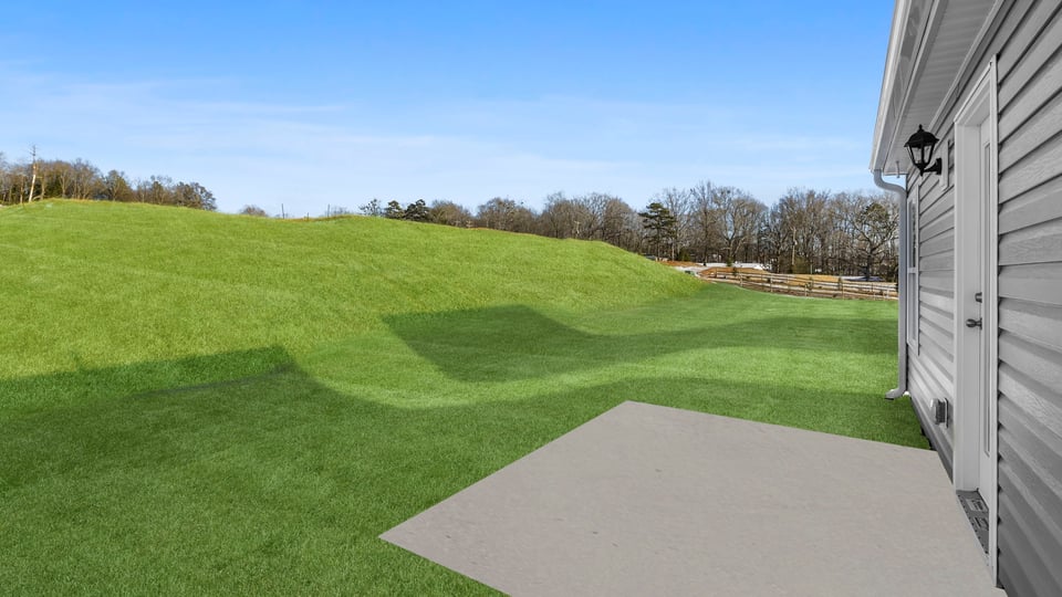 Back exterior with large backyard.