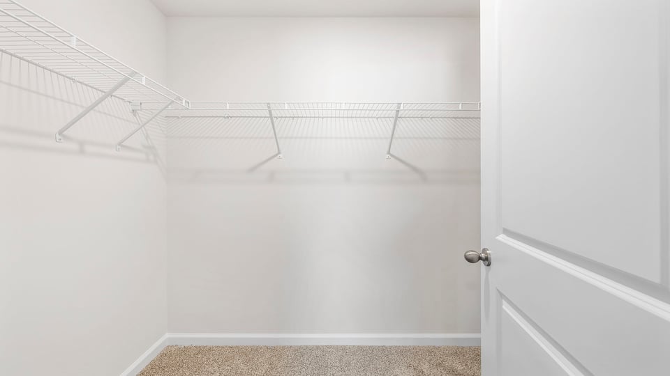 Primary bedroom walk-in closet.