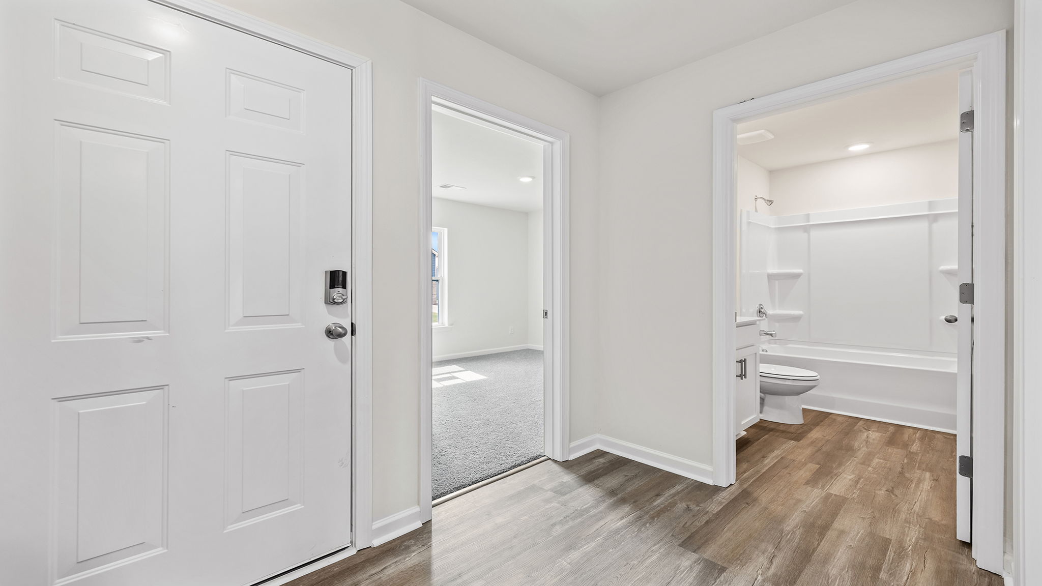 View of hallway bathroom and entrance to another bedroom.