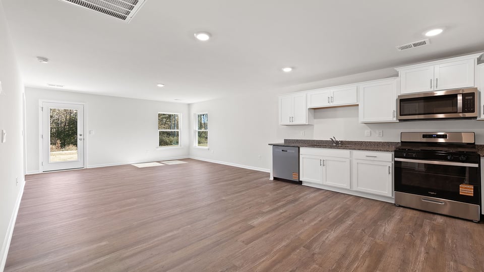 Open floor plan with lots of windows.