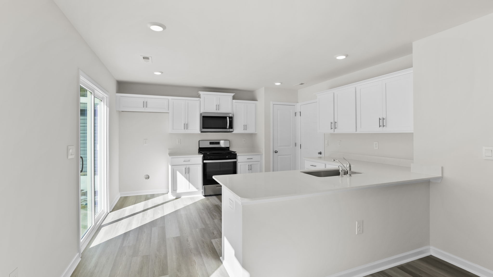 White cabinets and quartz countertops.
