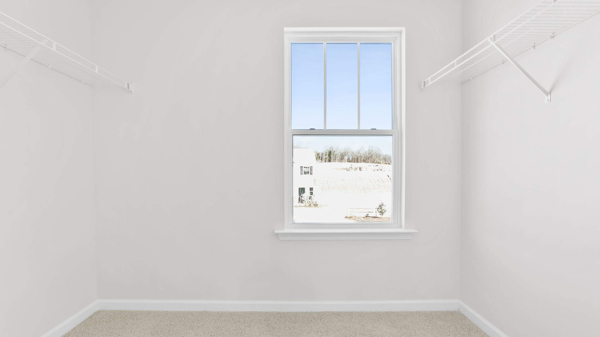 Primary bedroom walk-in closet.