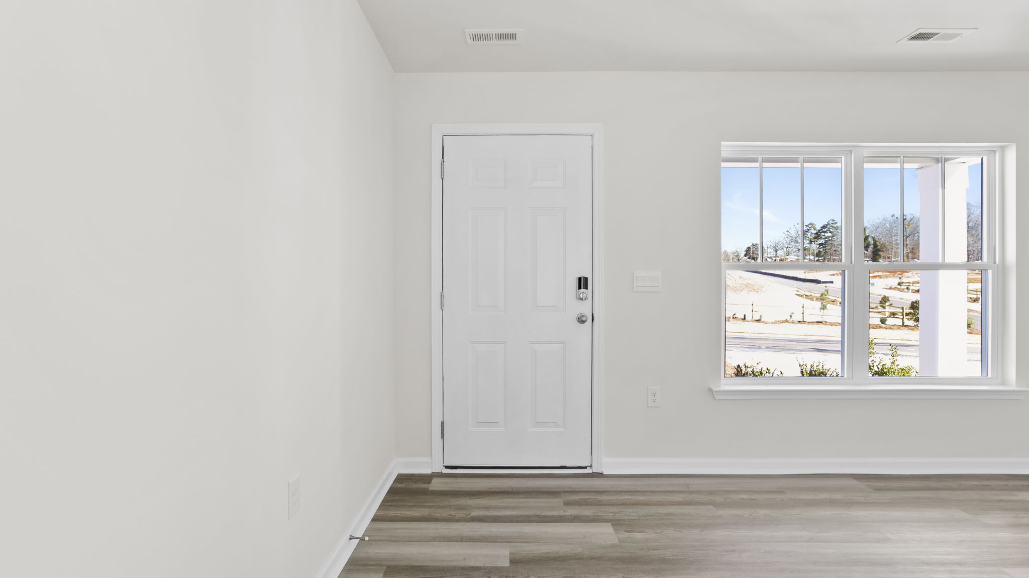 Entrance and view of large windows in the family room.