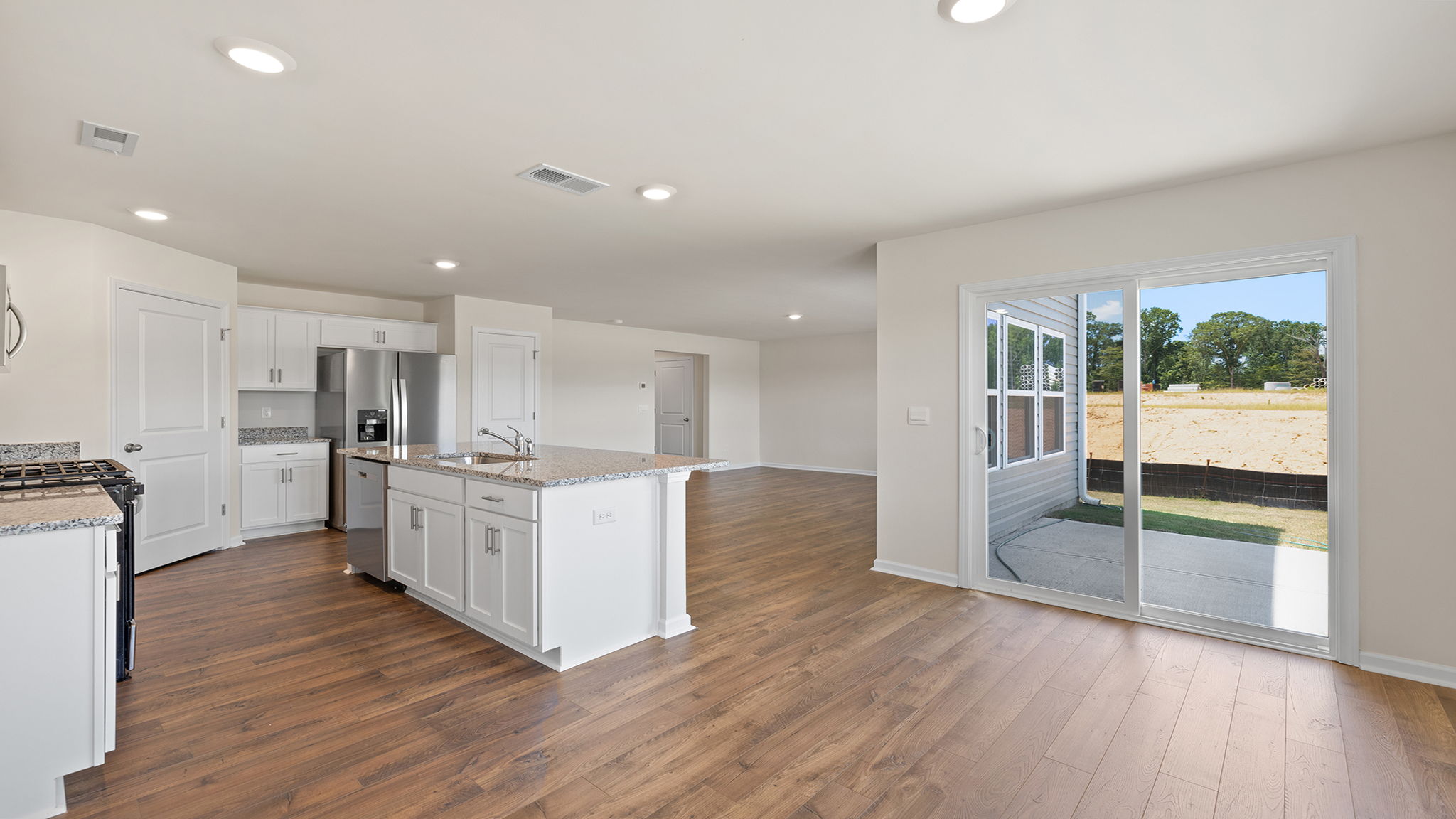 View of kitchen and adjoining dining area.