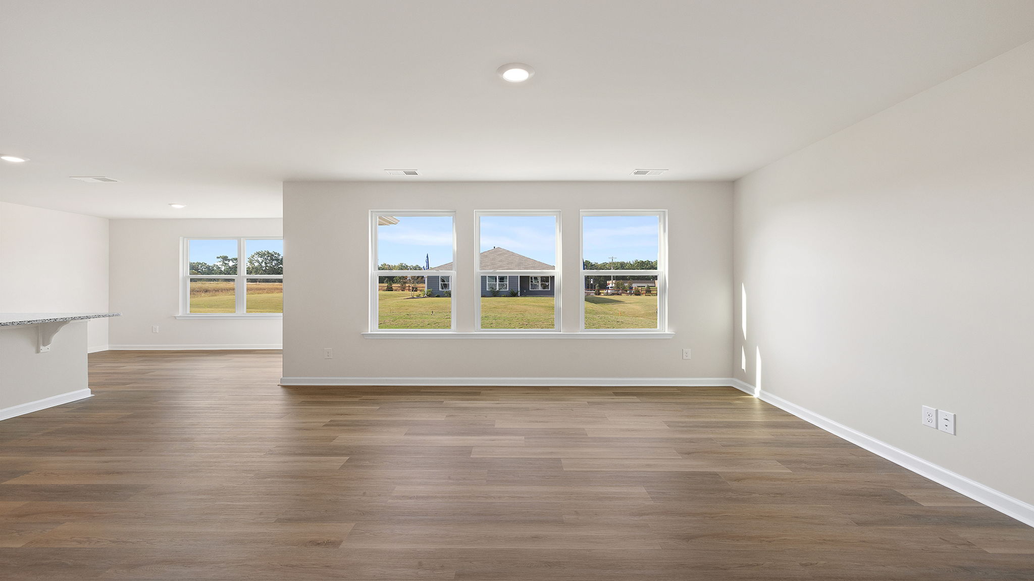 Family room has wall of windows.