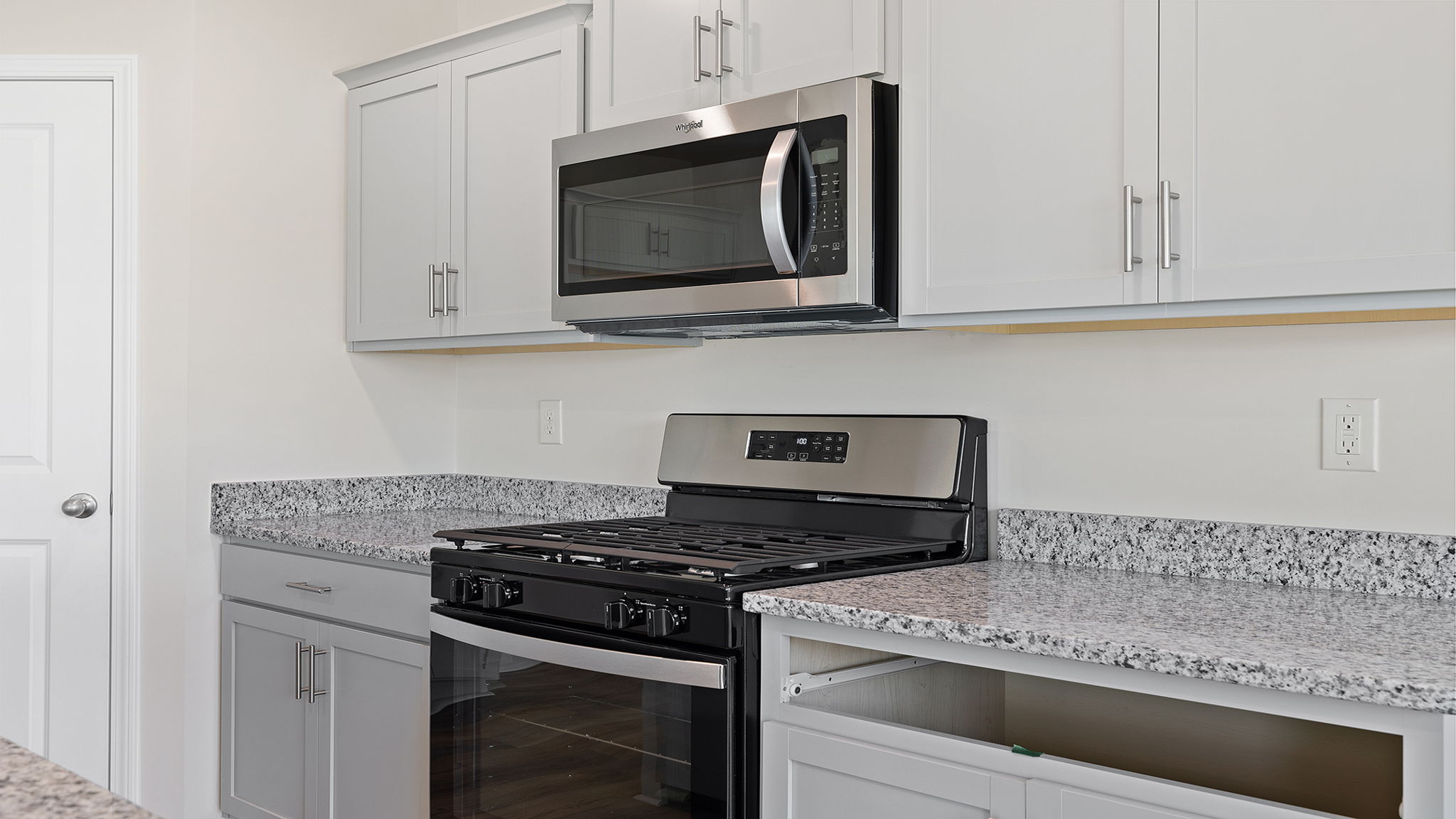 Kitchen features stainless steel appliances.