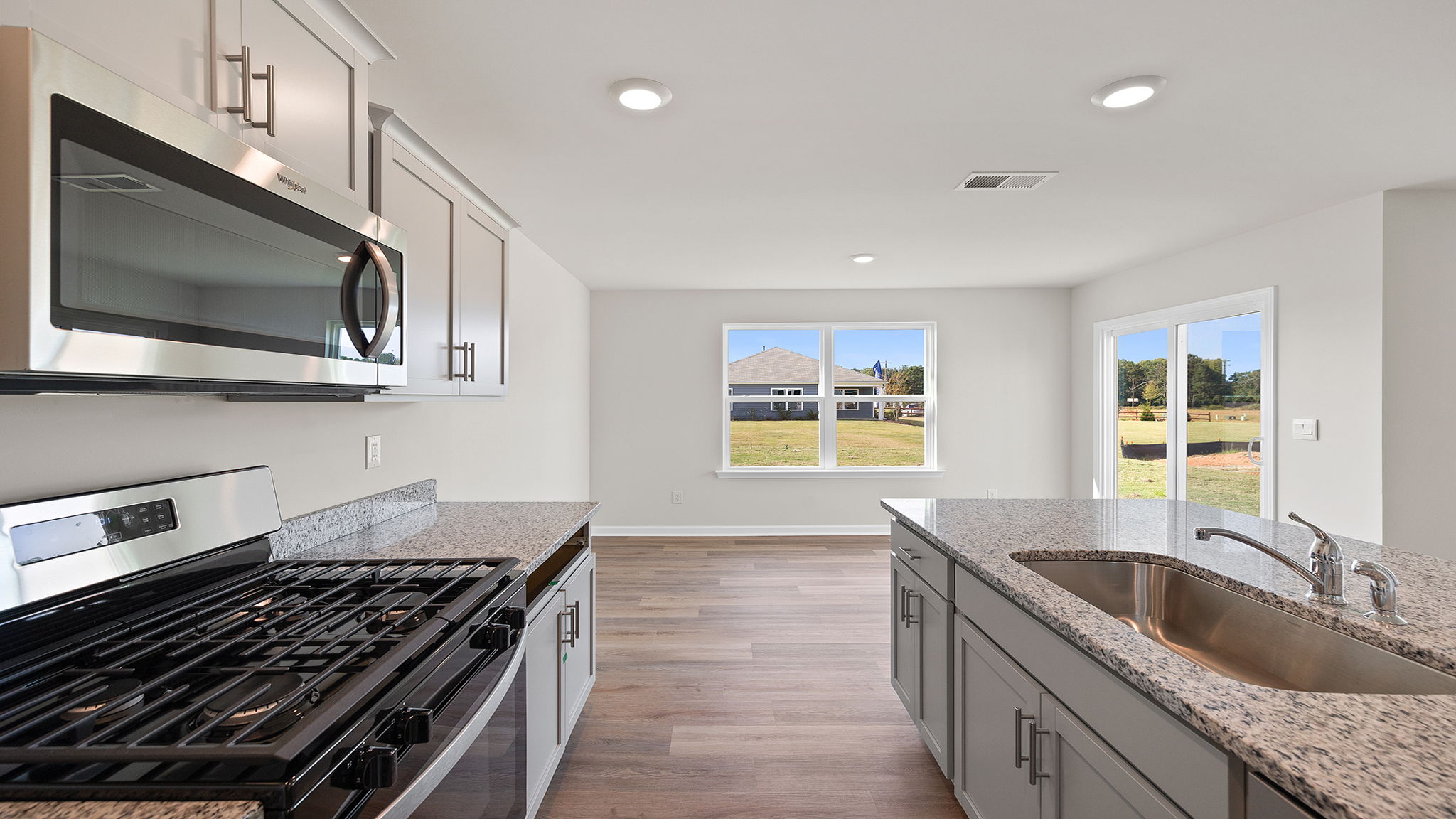 View from kitchen toward the dining area and door to the back yard.