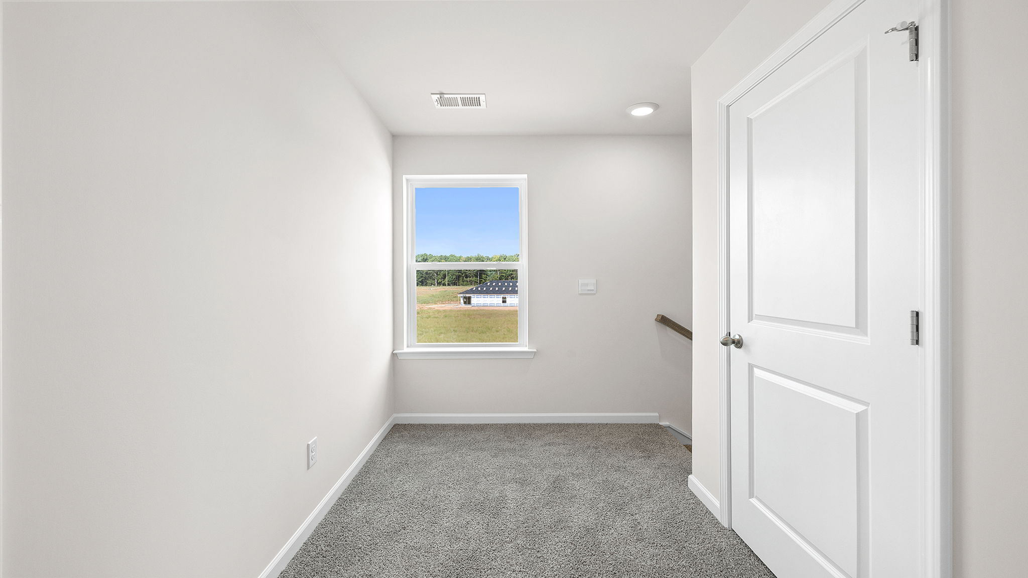View of landing at top of the stairs and hallway to bedrooms.
