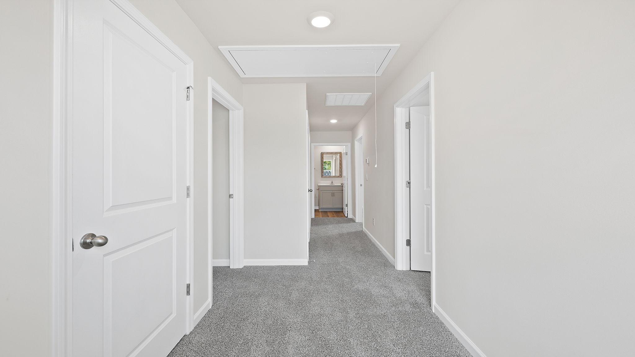 View of landing at top of the stairs and hallway to bedrooms.