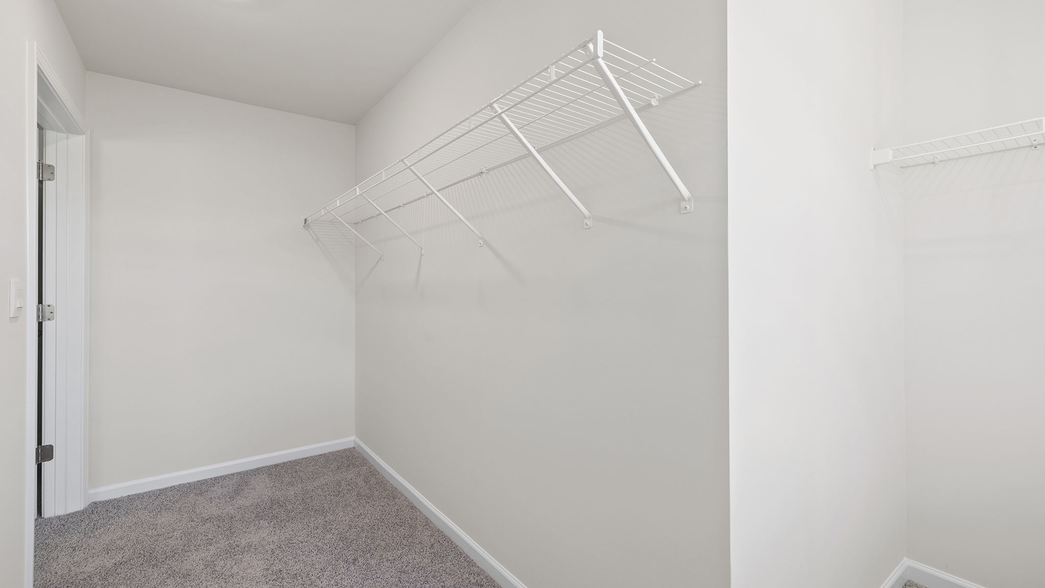 Primary bedroom walk-in closet.
