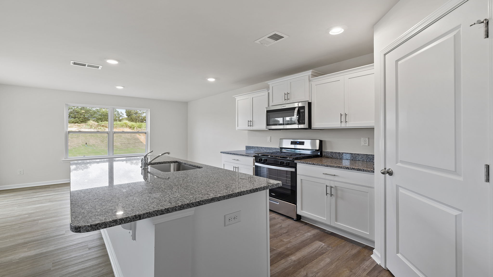 View of kitchen and dining area.