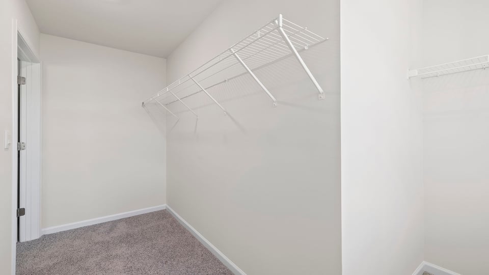 Primary bedroom walk-in closet.