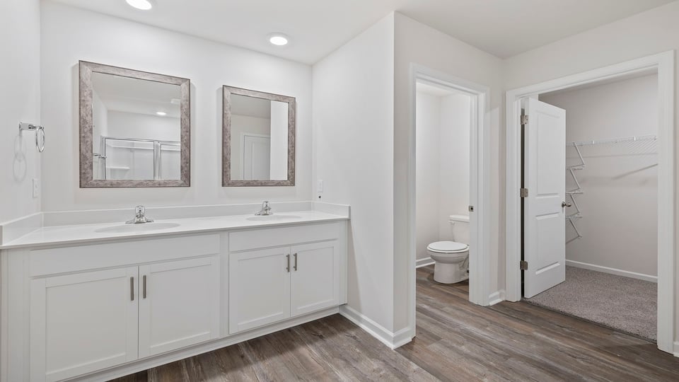 Primary bathroom with dual sink vanity.