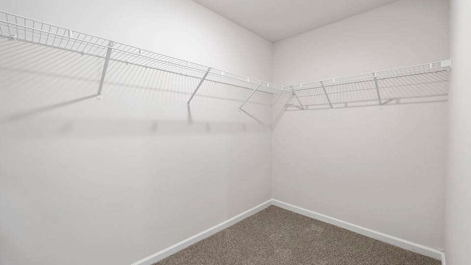 Primary bedroom walk-in closet.