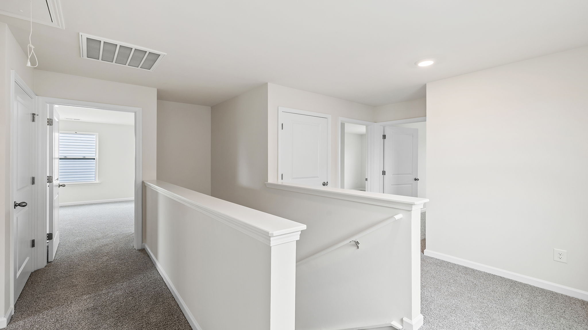 Upper level landing and view of hallway.