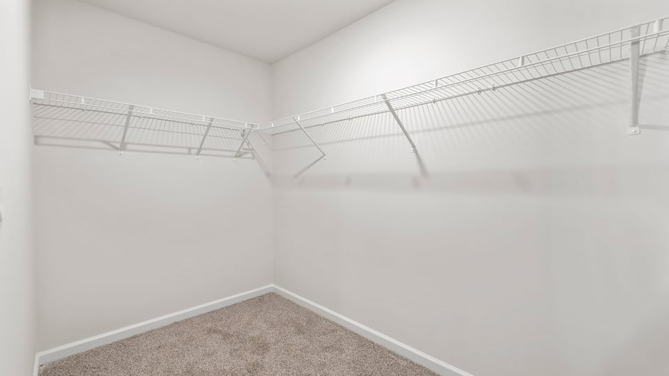Primary bedroom walk-in closet.