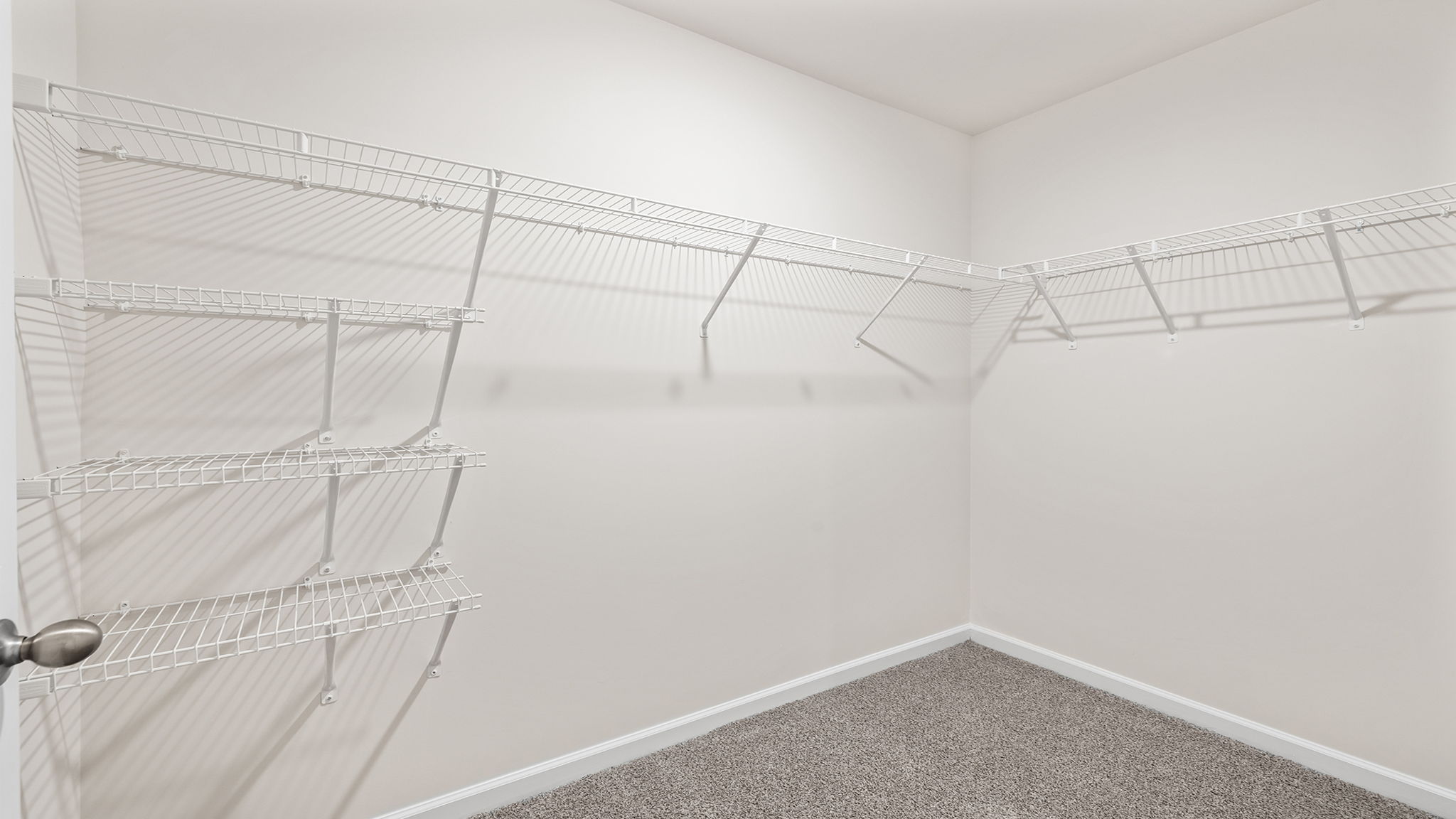 Primary bedroom walk-in closet.